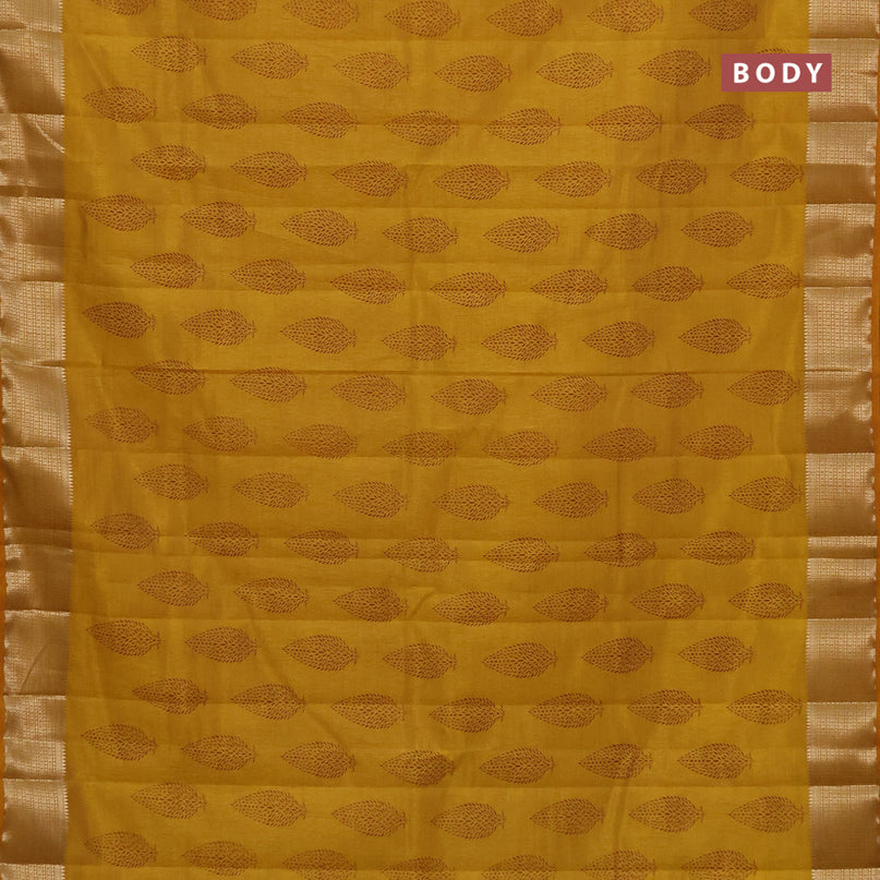 Semi raw silk saree mustard yellow with allover leaf prints and zari woven border