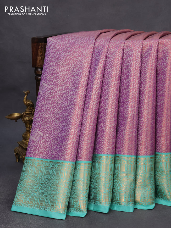 Tissue semi kanchipuram saree dual shade of lavender and teal green shade with allover zari woven brocade weaves and rich zari woven korvai border