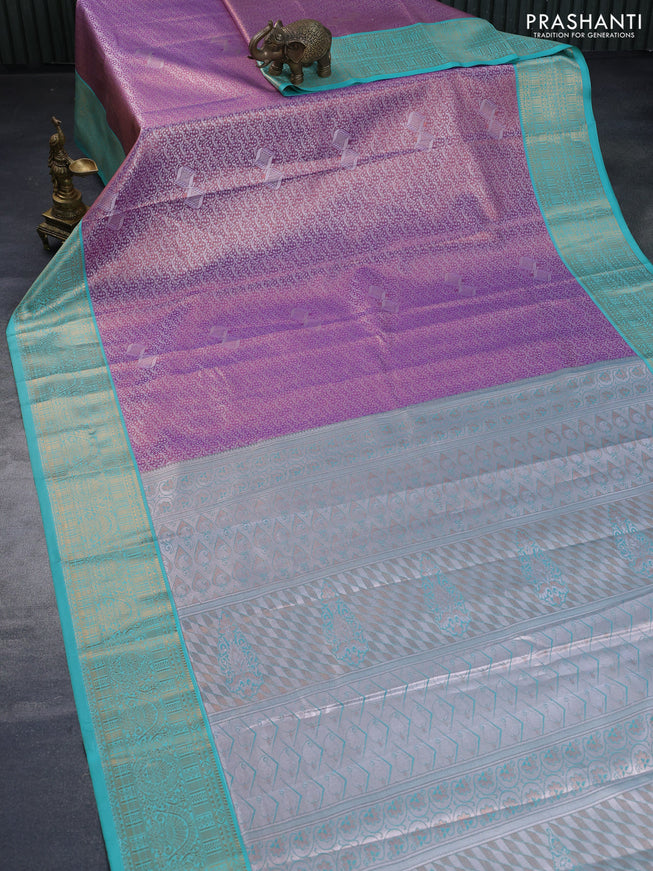 Tissue semi kanchipuram saree dual shade of lavender and teal green shade with allover zari woven brocade weaves and rich zari woven korvai border