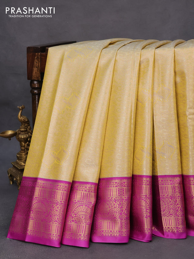 Tissue semi kanchipuram saree yellow and purple with allover zari woven brocade weaves and rich zari woven korvai border