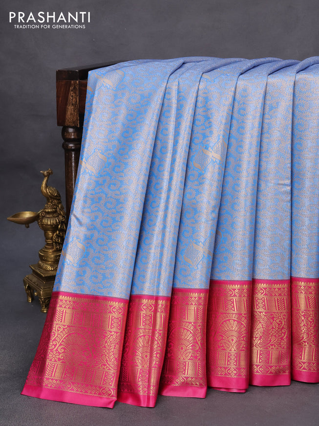 Tissue semi kanchipuram saree blue and pink with allover zari woven brocade weaves and rich zari woven korvai border