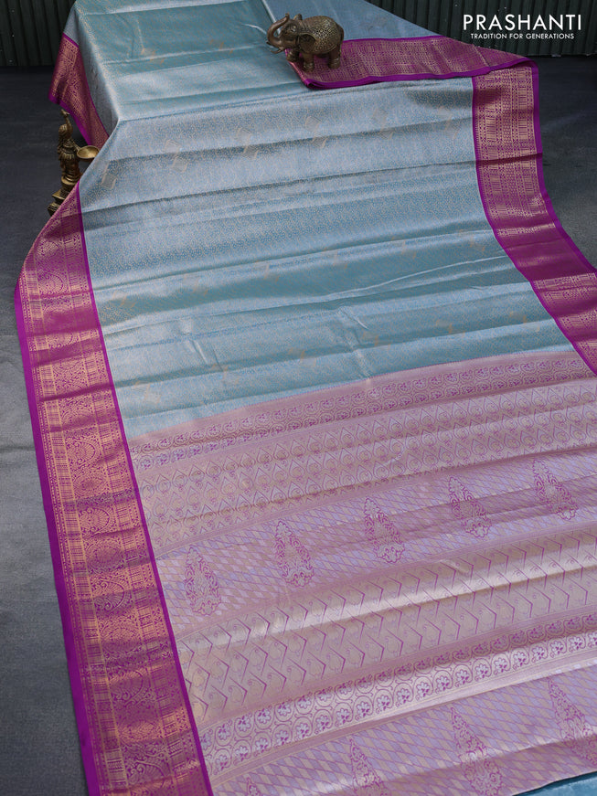 Tissue semi kanchipuram saree teal blue and purple with allover zari woven brocade weaves and zari woven korvai border