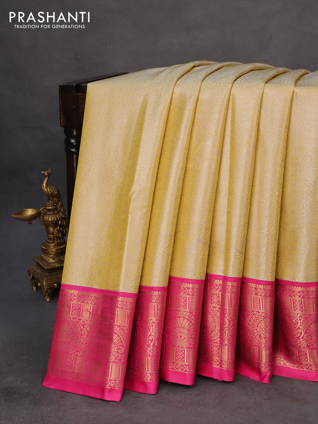 Tissue semi kanchipuram saree pale yellow and pink with allover zari woven brocade weaves and zari woven korvai border