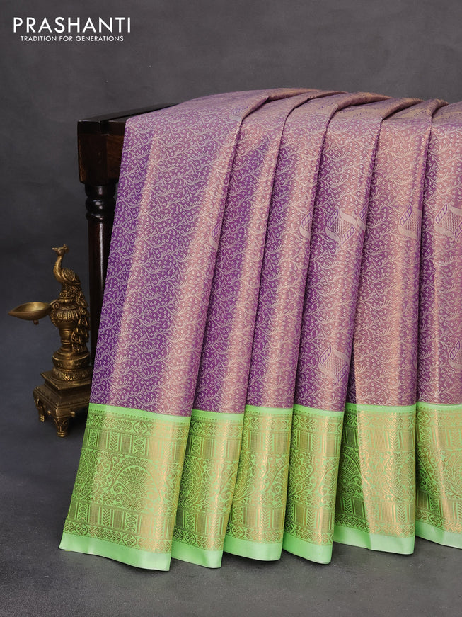 Tissue semi kanchipuram saree lavender and teal green shade with allover silver zari woven brocade weaves and zari woven korvai border