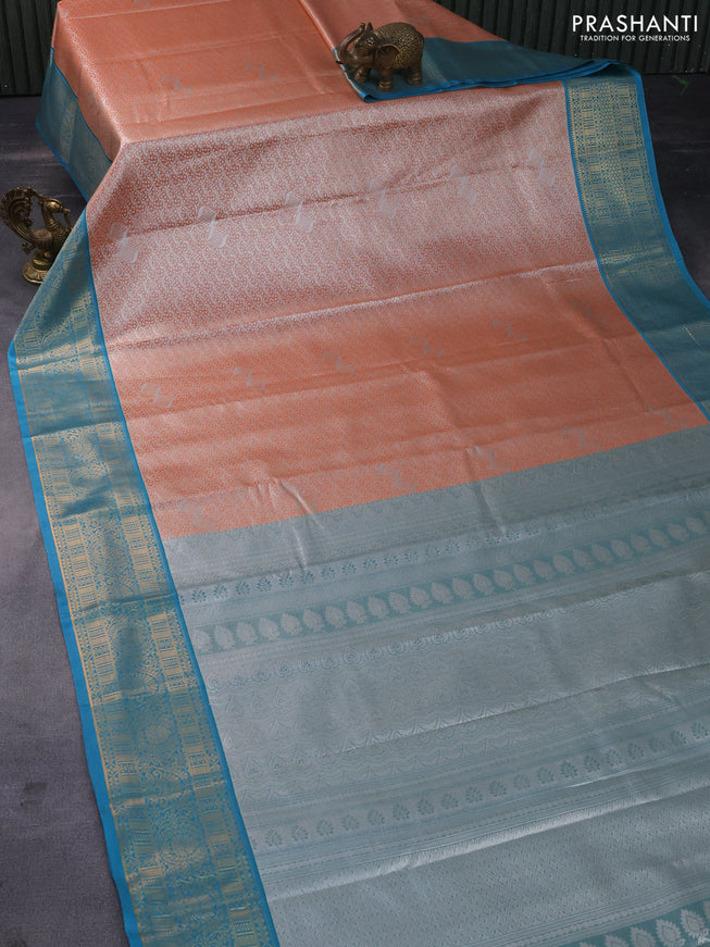 Tissue semi kanchipuram saree orange and cs blue with allover silver zari woven brocade weaves and zari woven korvai border