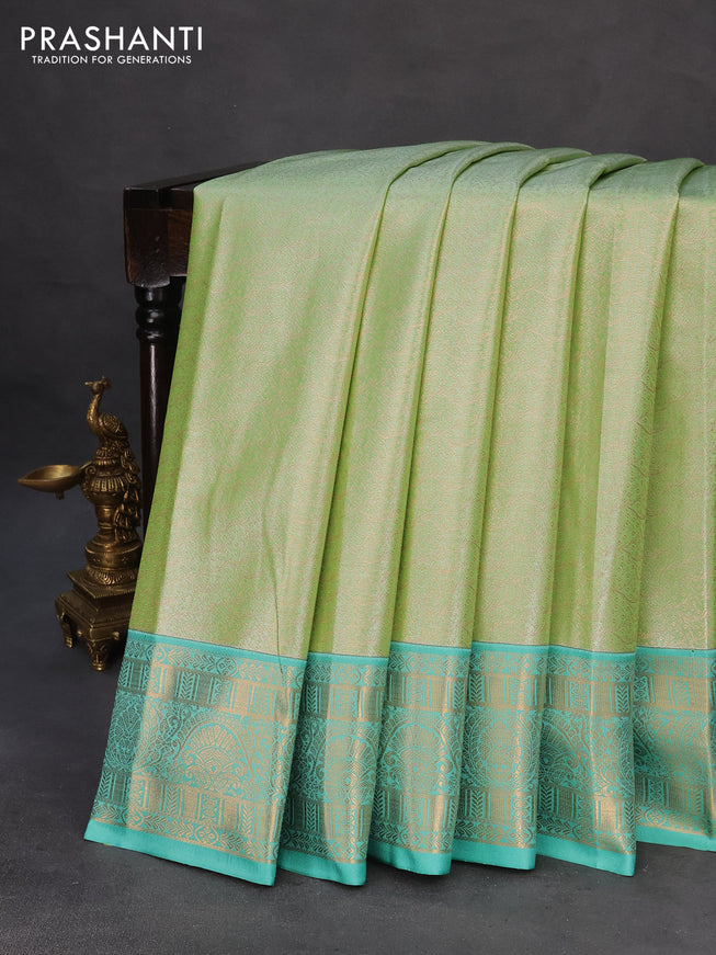 Tissue semi kanchipuram saree green and teal green with allover zari woven brocade weaves and zari woven korvai border