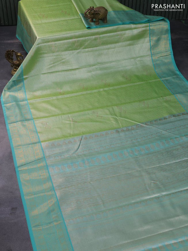 Tissue semi kanchipuram saree green and teal green with allover zari woven brocade weaves and zari woven korvai border