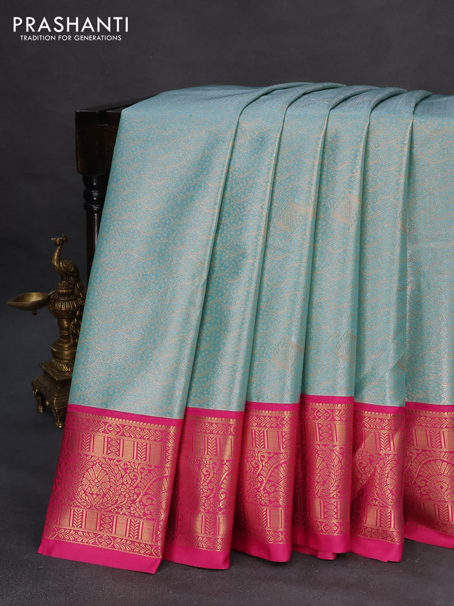 Tissue semi kanchipuram saree teal blue and pink with allover zari woven brocade weaves and rich zari woven korvai border