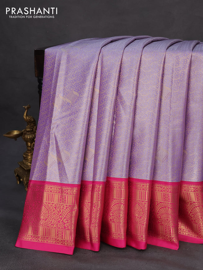 Tissue semi kanchipuram saree lavender and pink with allover zari woven brocade weaves and rich zari woven korvai border