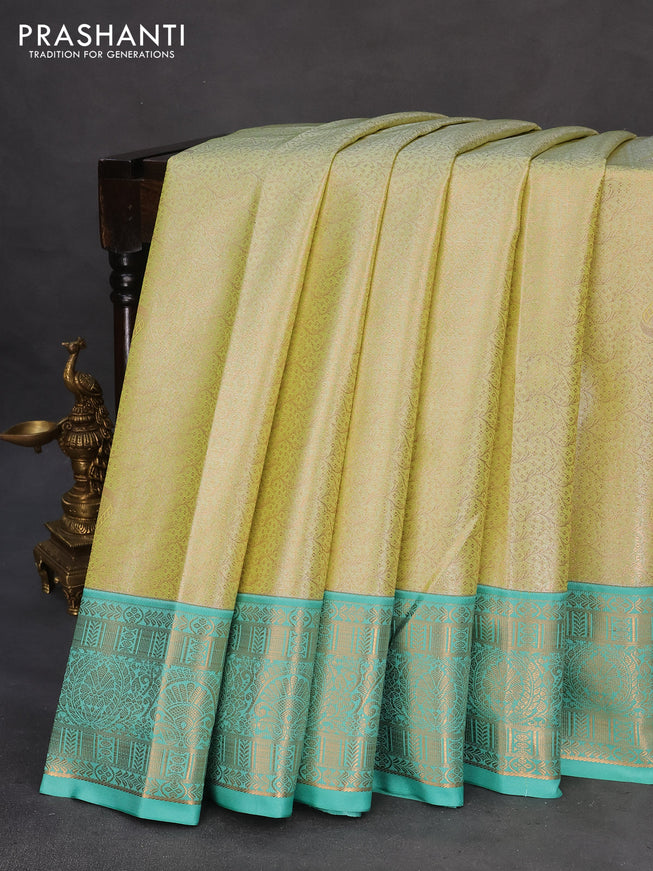 Tissue semi kanchipuram saree pista green and teal green with allover zari woven brocade weaves and rich zari woven korvai border