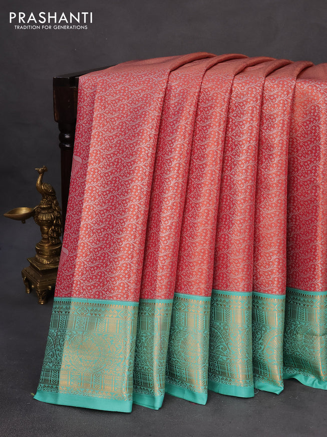 Tissue semi kanchipuram saree red shade and teal green with allover zari woven brocade weaves and rich zari woven korvai border