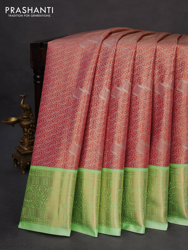 Tissue semi kanchipuram saree dual shade of reddish pink and light green with allover zari woven brocade weaves and rich zari woven korvai border