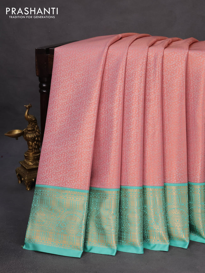 Tissue semi kanchipuram saree peach pink and teal green with allover zari woven brocade weaves and rich zari woven korvai border