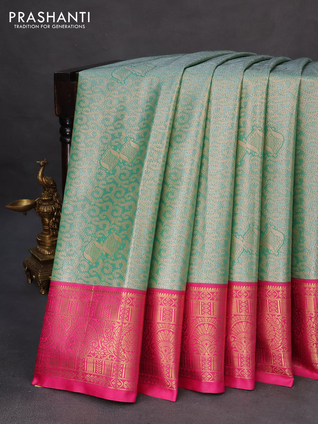 Tissue semi kanchipuram saree green and pink with allover zari woven brocade weaves and rich zari woven korvai border