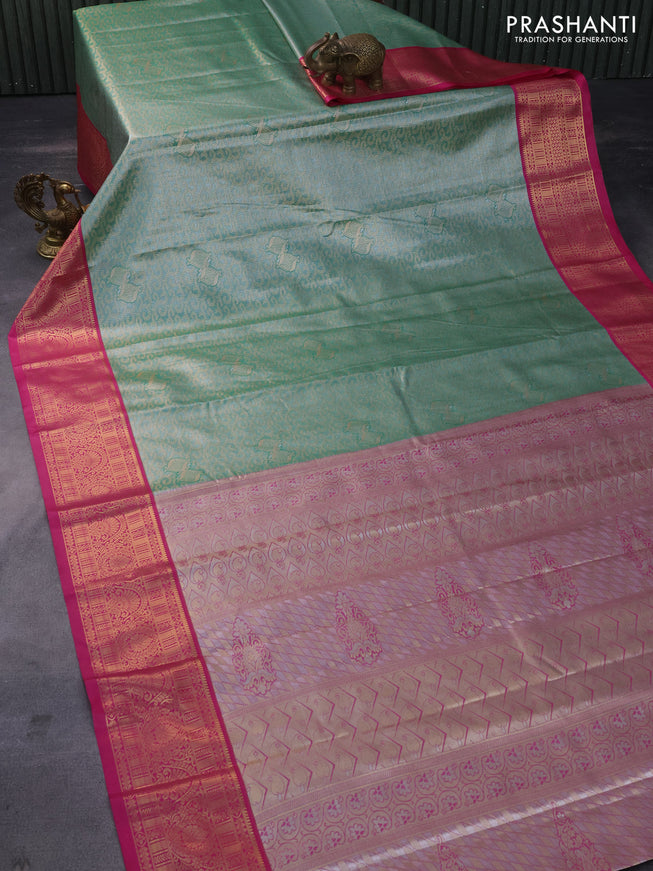 Tissue semi kanchipuram saree green and pink with allover zari woven brocade weaves and rich zari woven korvai border