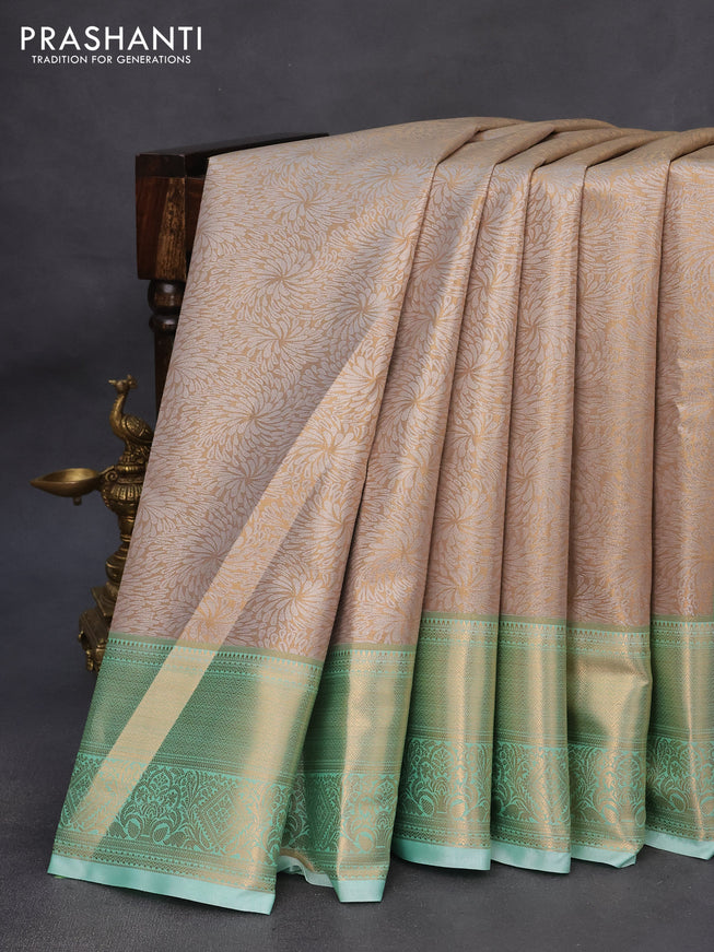 Tissue semi kanchipuram saree beige and teal green shade with allover zari woven brocade weaves and zari woven border