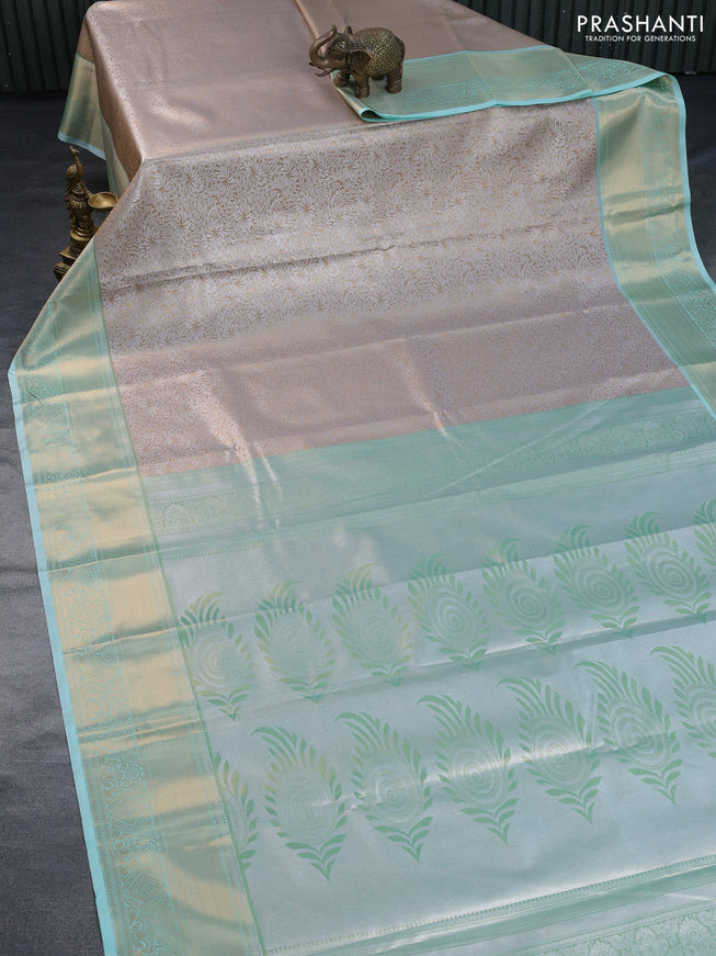 Tissue semi kanchipuram saree beige and teal green shade with allover zari woven brocade weaves and zari woven border