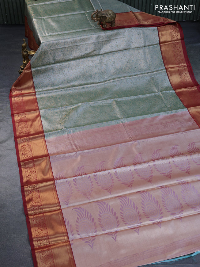 Tissue semi kanchipuram saree pastel green shade and maroon with allover zari woven brocade weaves and zari woven border