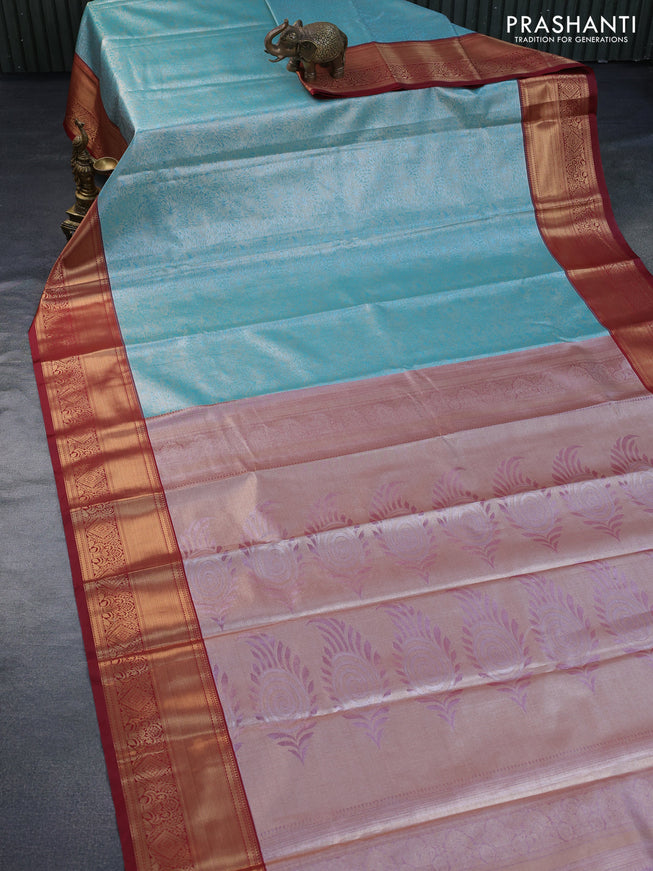 Tissue semi kanchipuram saree teal blue shade and maroon with allover zari woven brocade weaves and zari woven border