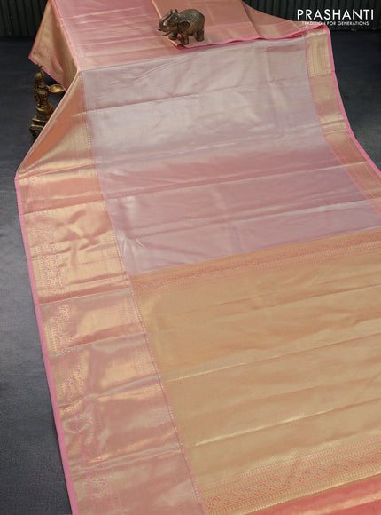 Tissue semi kanchipuram saree peach shade with allover zari woven brocade weaves and long zari woven border