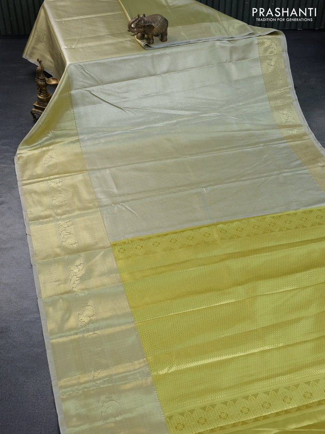 Tissue semi kanchipuram saree yellow and beige with allover silver zari woven brocade weaves and long zari woven border