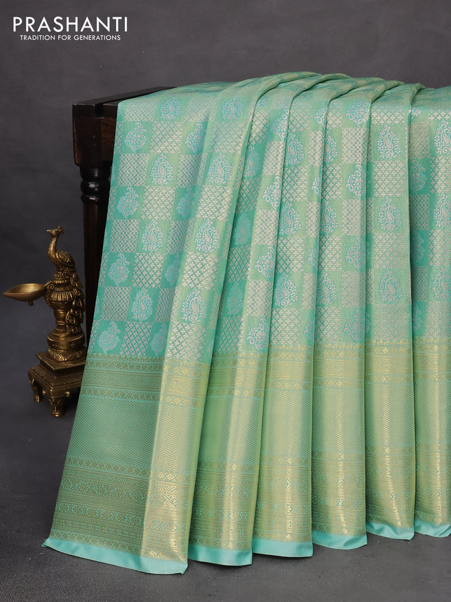 Tissue semi kanchipuram saree teal green shade with allover silver zari woven brocade weaves and long zari woven border