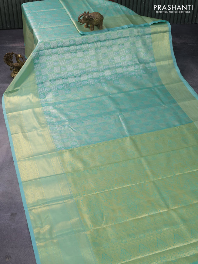 Tissue semi kanchipuram saree teal green shade with allover silver zari woven brocade weaves and long zari woven border