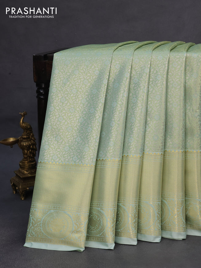 Tissue semi kanchipuram saree pastel green with allover silver zari woven brocade weaves and long zari woven border