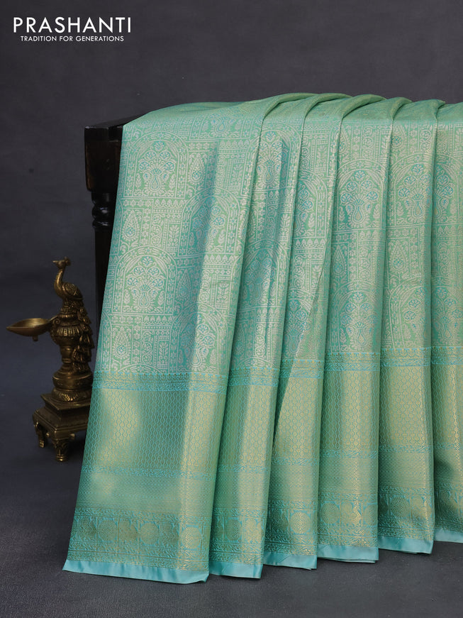 Tissue semi kanchipuram saree teal green shade and teal blue with allover silver zari woven brocade weaves and long zari woven border