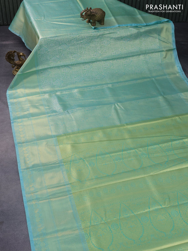 Tissue semi kanchipuram saree teal green shade and teal blue with allover silver zari woven brocade weaves and long zari woven border