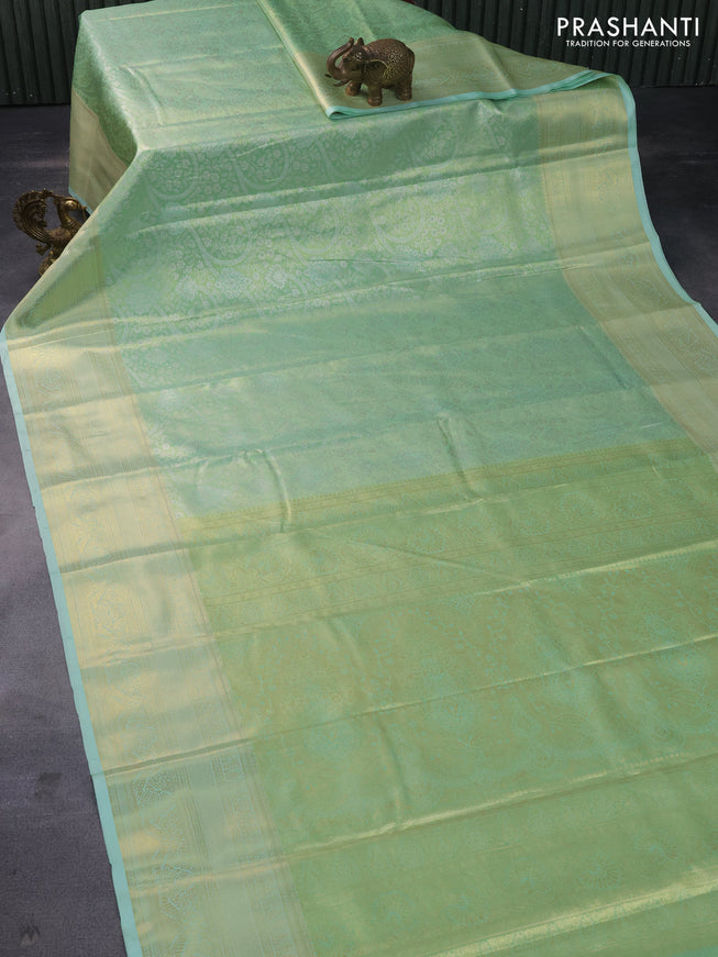 Tissue semi kanchipuram saree light green with allover silver zari woven brocade weaves and long zari woven border