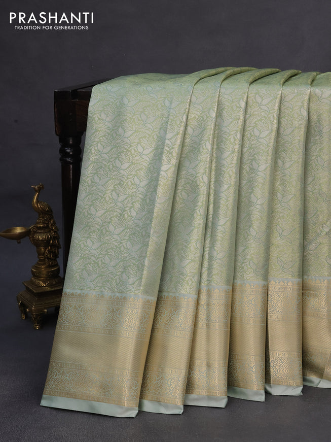 Tissue semi kanchipuram saree pastel green and pastel grey with allover silver zari woven brocade weaves and zari woven border