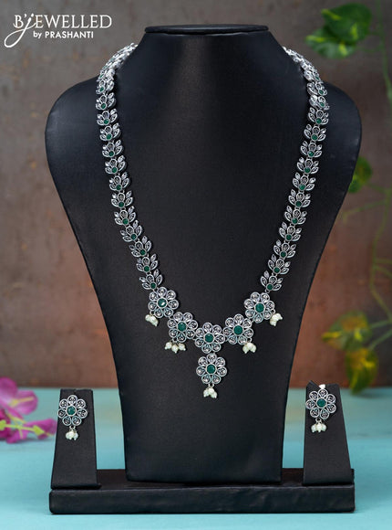 Oxidised haaram floral design with emerald stones and pearl hangings