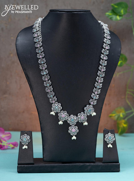 Oxidised haaram floral design with mint green & baby pink stones and pearl hangings