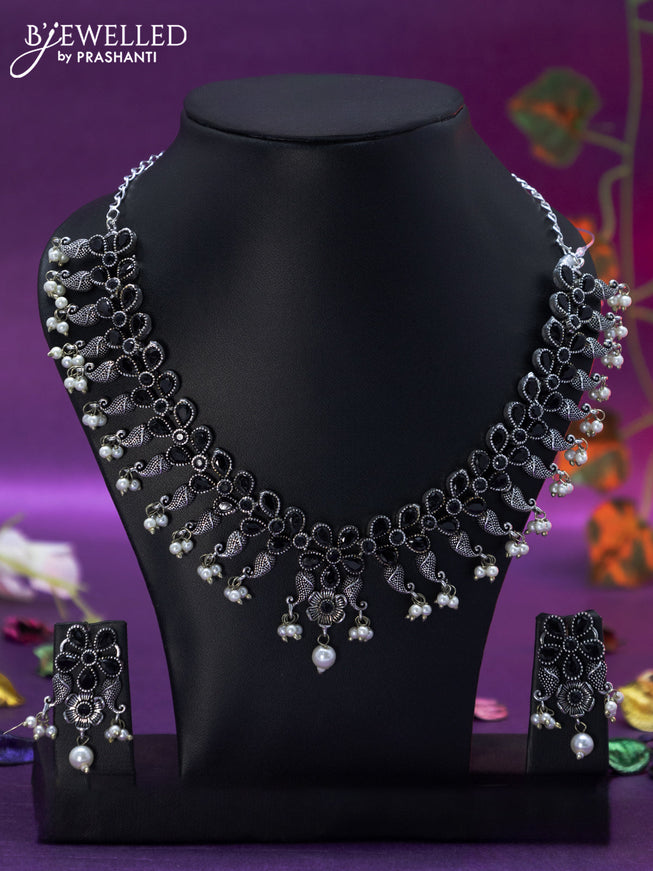 Oxidised necklace floral design with black stones and pearl hangings