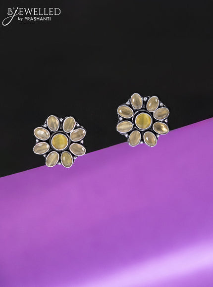 Oxidised earrings floral design with yellow stones