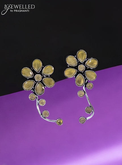 Oxidised earrings floral design with yellow stones