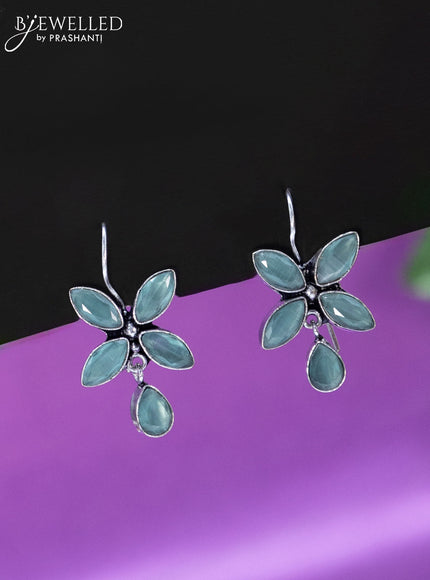 Oxidised hanging type earring with mint green stones