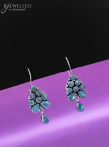 Oxidised hanging type earring with ice blue stones