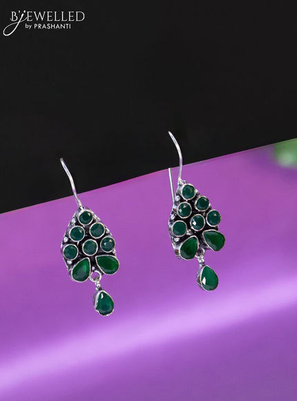 Oxidised hanging type earring with emerald stones