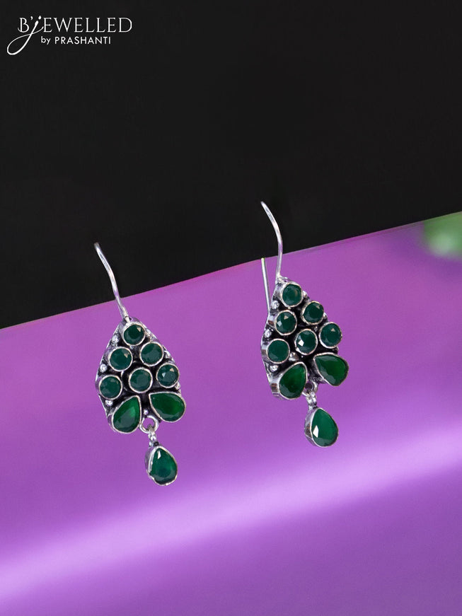 Oxidised hanging type earring with emerald stones