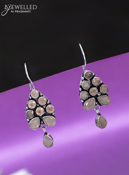 Oxidised hanging type earring with peach stones