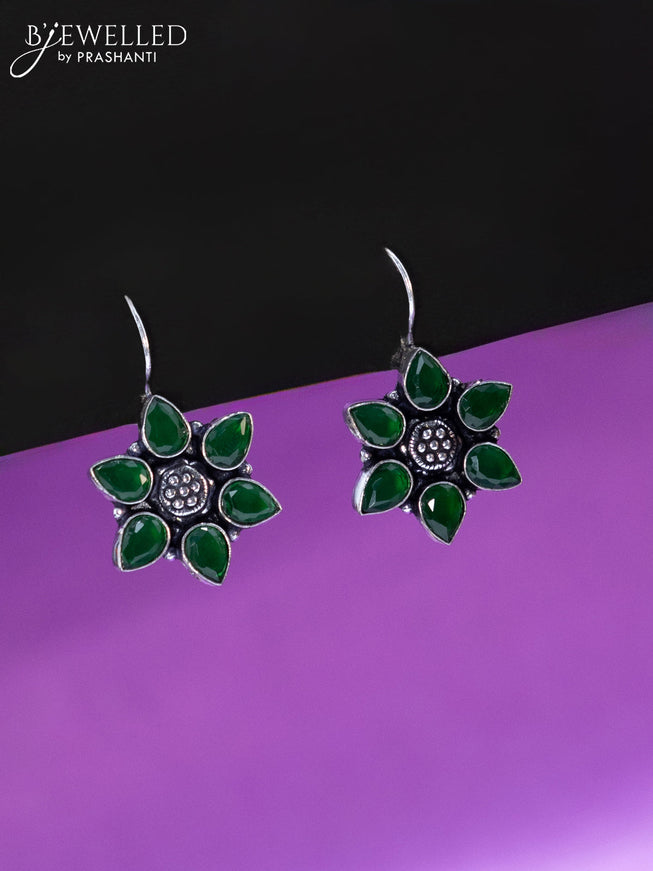 Oxidised hanging type earring floral design with emerald stones