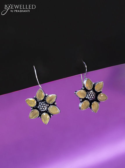 Oxidised hanging type earring floral design with yellow stones