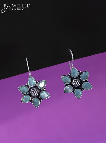 Oxidised hanging type earring floral design with mint green stones