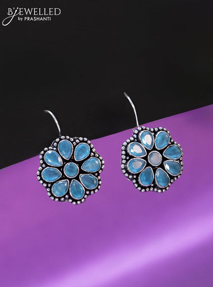 Oxidised hanging type earring floral design with ice blue stones