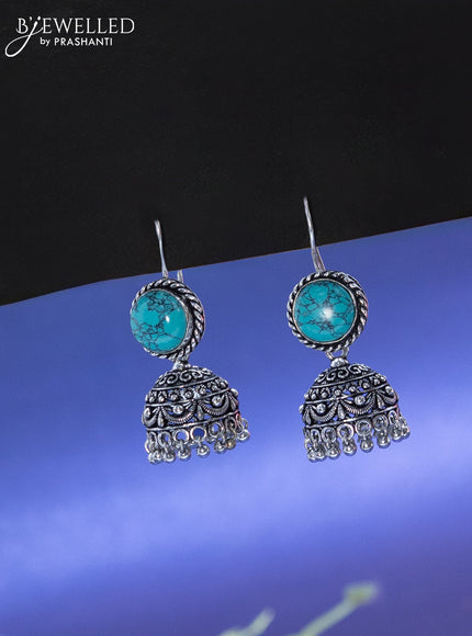 Oxidised hanging type jhumka with light blue stone and hangings