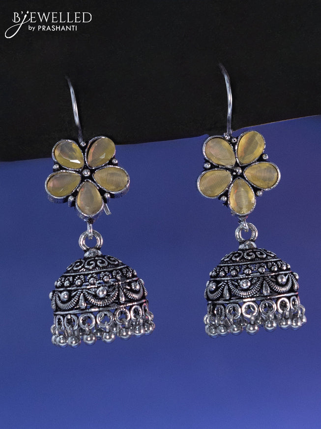 Oxidised hanging type jhumka floral design with yellow stone and hangings