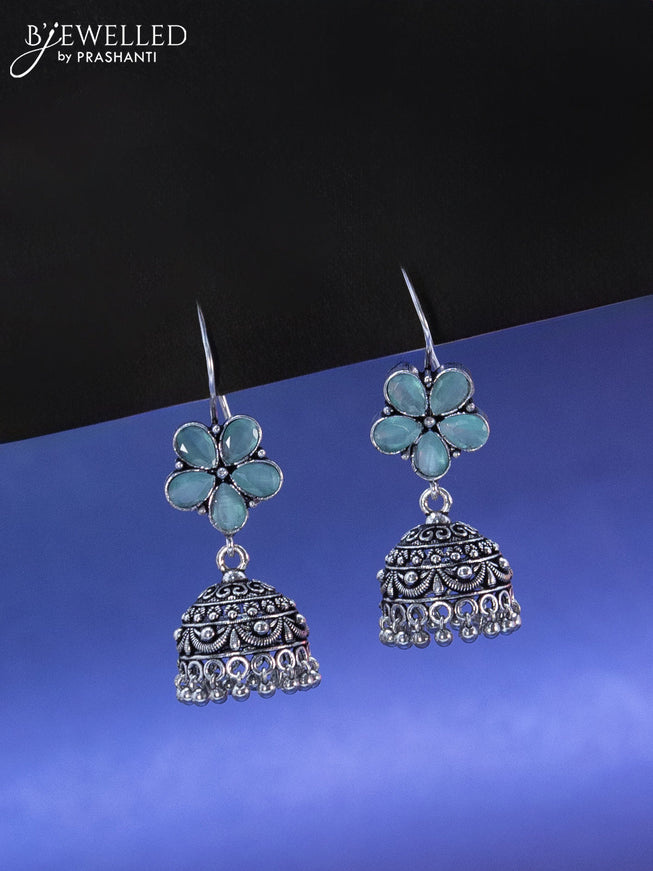 Oxidised hanging type jhumka floral design with mint green stone and hangings