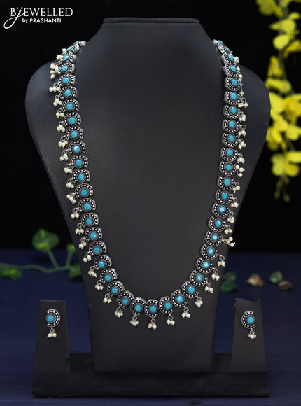 Oxidised haaram with ice blue stones and pearl hangings